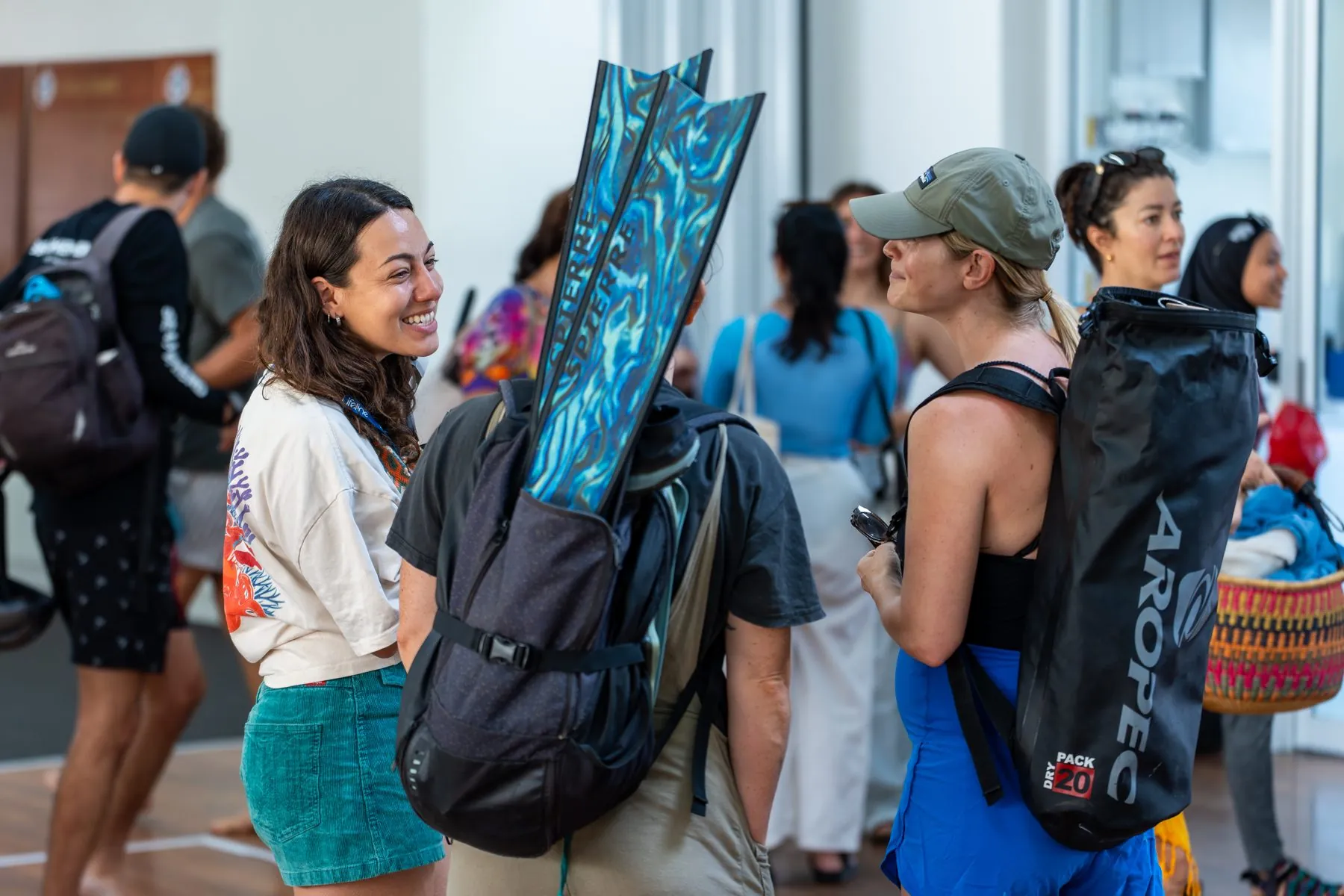 Divers gathering with freediving fins and gear